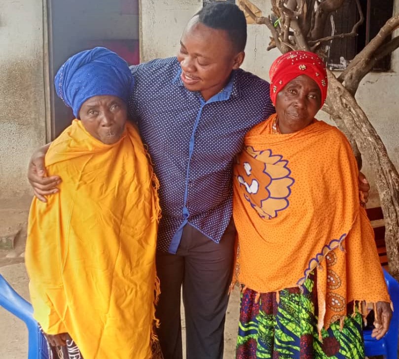 Alfred showing love for elderly twin women
